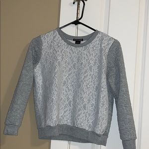 Long sleeve shirt w/ Lace on front.